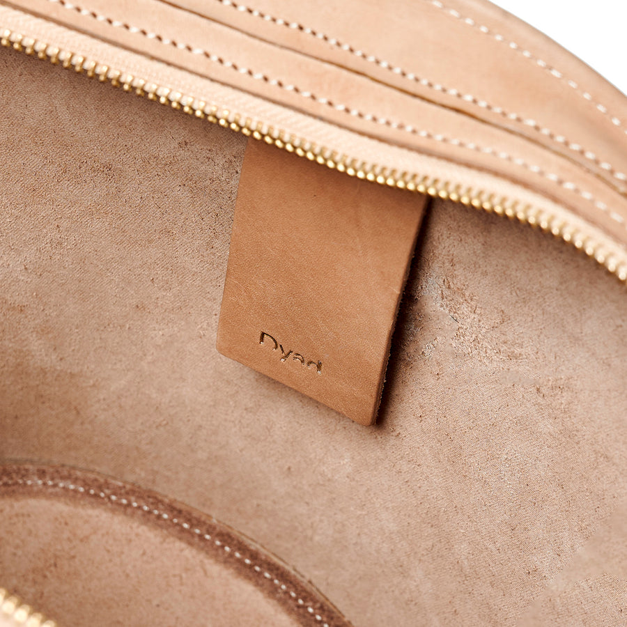 Project Dyad || Almond Color trapeze-shaped cow leather Inner small pocket Rope handle Emele Zipper Bag